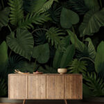 Wall murals Lush green tropical leaf pattern.