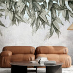 Wall murals Hanging leaves on textured wall.