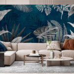 Wall murals Tropical leaves on teal background.