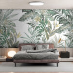 Wall murals Tropical leaves with delicate flowers.