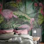 Wall murals Pink flamingo and green leaves