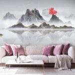 Wall murals Mountain range with a red tree in the middle of the water