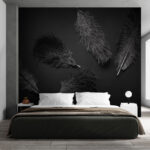 Wall murals Black feather on a black surface
