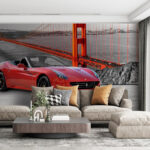 Wall murals Red sports car on a road with a bridge in the background
