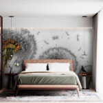 Wall murals Dandelions releasing seeds in the wind.