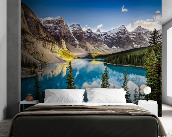 Wall mural Body of water with trees and mountains in the background