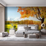 Wall murals Tree with orange leaves in a field