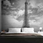 Wall murals Tall tower with a cloudy sky