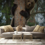 Wall murals Bear peeking from behind the tree.