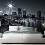 Wall murals Cityscape glowing beneath night sky.