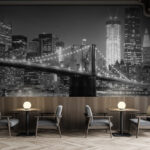 Wall murals Bridge over water with city skyline in the background