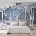 Wall murals Paper cut out of a deer in a forest
