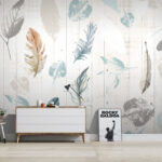 Wall murals Group of feathers on a wood surface