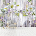Wall murals Group of white flowers on a wood surface
