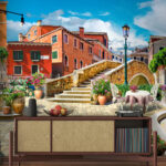Wall murals Patio with a table and chairs and a fountain in front of a building
