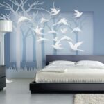 Wall murals Paper cut out of birds flying in the air