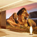 Wall murals Lions resting by serene waters.