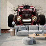 Wall murals Car bursts through cracked wall.