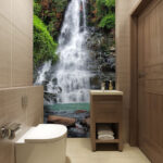 Wall murals Majestic waterfall amid lush greenery.
