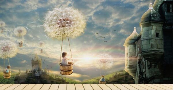 Wall murals Girl in a basket on a swing with a dandelion in the sky Wall murals Girl in a basket on a swing with a dandelion in the sky