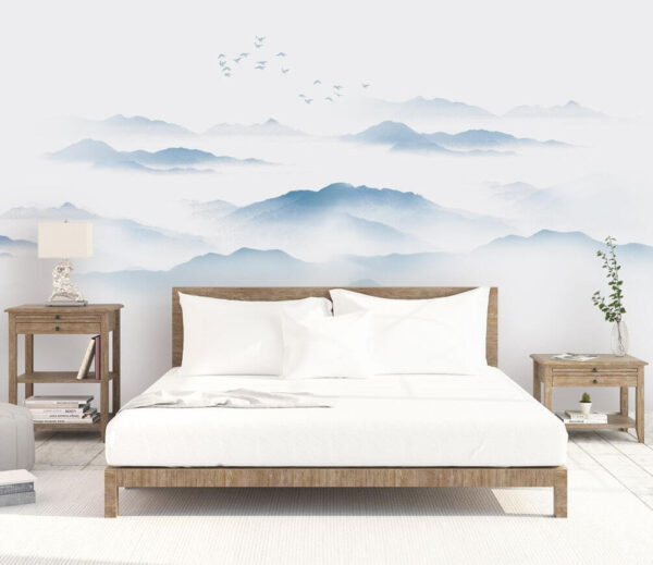 Wall murals Birds flying over a foggy mountain range Wall murals Birds flying over a foggy mountain range