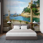 Wall murals Balcony with columns and flowers on the side of the ocean