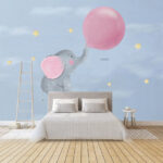 Wall murals Cartoon of an elephant holding a balloon