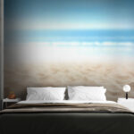 Wall murals Sandy beach under clear blue sky.