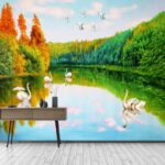 Wall murals Painting of swans on a lake