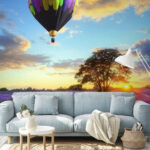 Wall murals Group of hot air balloons flying over a field of flowers