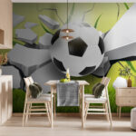 Wall murals Soccer ball breaking through surface.