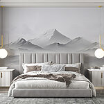 Wall murals Snowy mountain with a mountain in the background