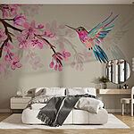 Wall murals Hummingbird hovers near vibrant blossoms.