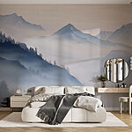 Wall murals Mountain range with trees and fog