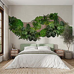 Wall murals Group of green leaves on a wooden surface