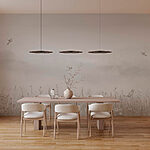 Wall murals Bird flying over a field of flowers