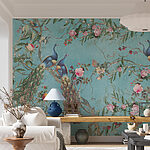 Wall mural Peacocks and flowers on blue background