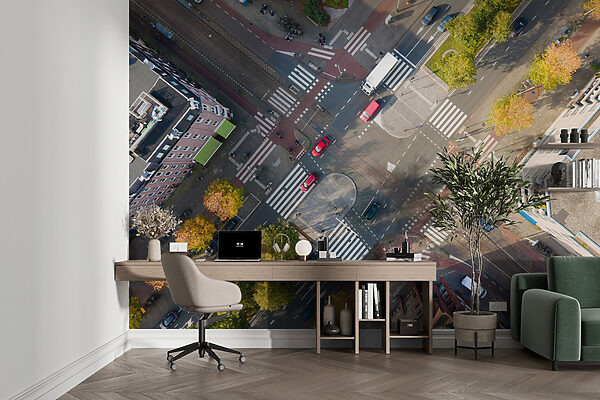 Wall mural Aerial view of a street intersection with cars and buildings (SKU: u98641)