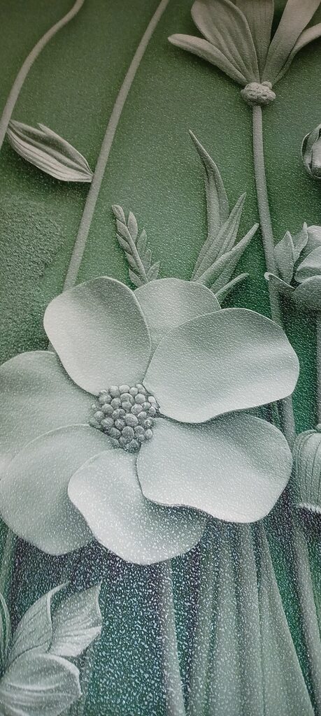Wall mural Grey sculpture of flowers and plants