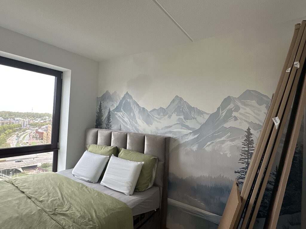 Wall mural Lake surrounded by snow and mountains